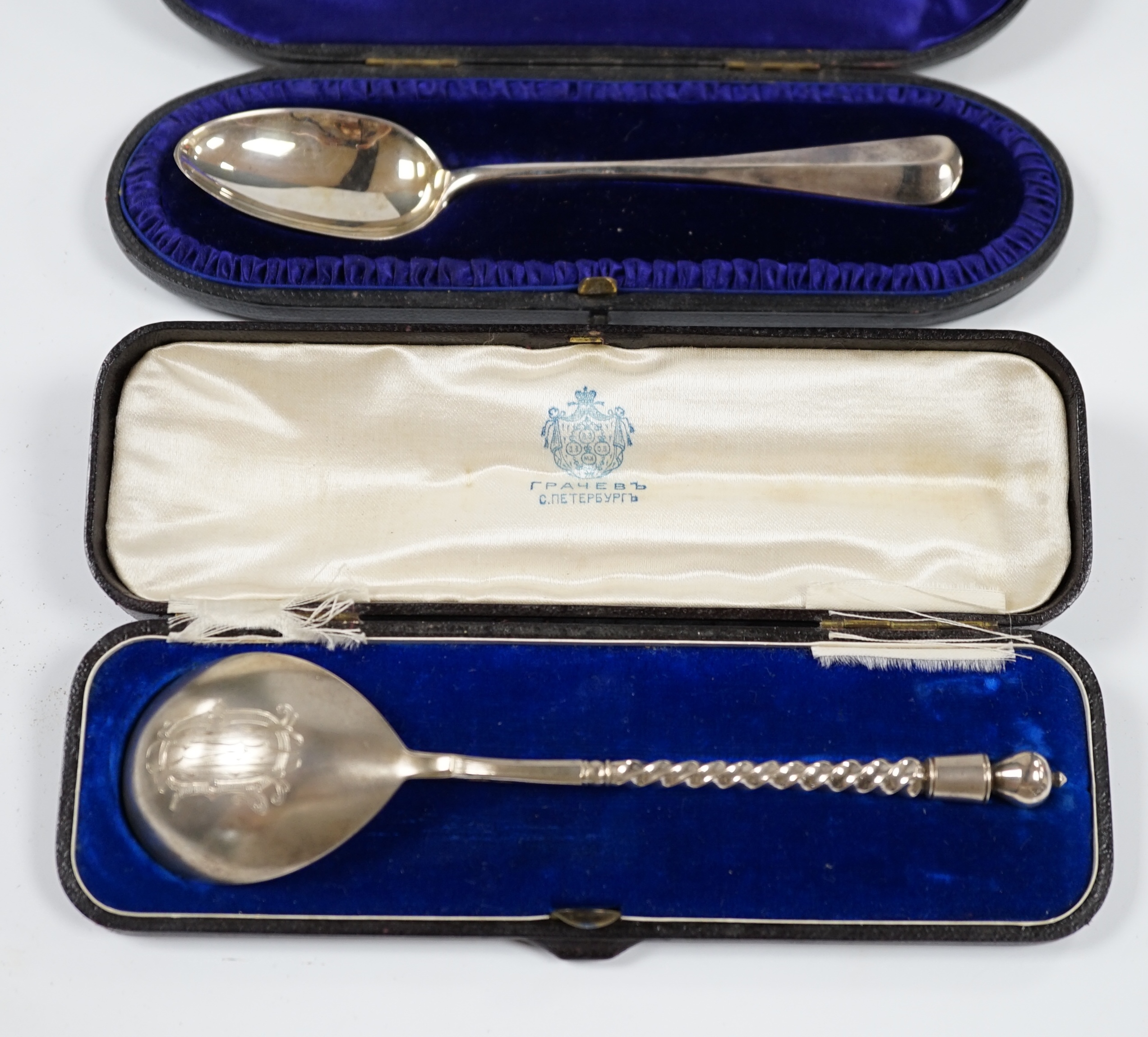 A cased Russian 84 zolotnik spoon, 16.8cm and a cased Victorian silver dessert spoon, London, 1893. Condition - fair to good